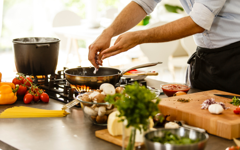 chef-prepared meals being made in the gourmet dinner service kitchen