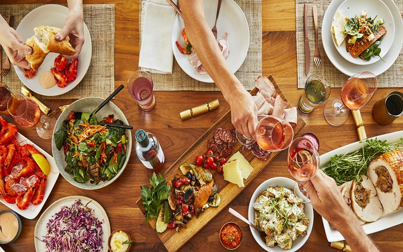 Christmas lunch cost per person with hamper spread on a table as a guide